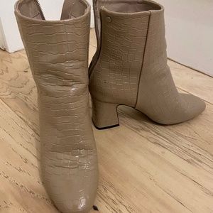 Snake skin ankle boot.